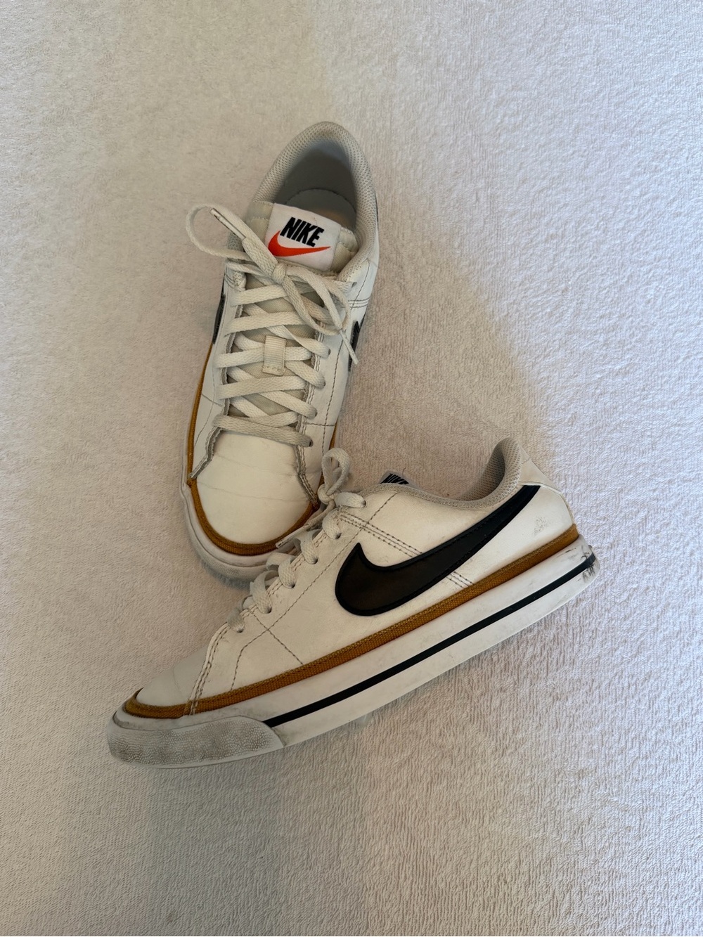 Nike White Sneakers with Black Swoosh and Tan Accent